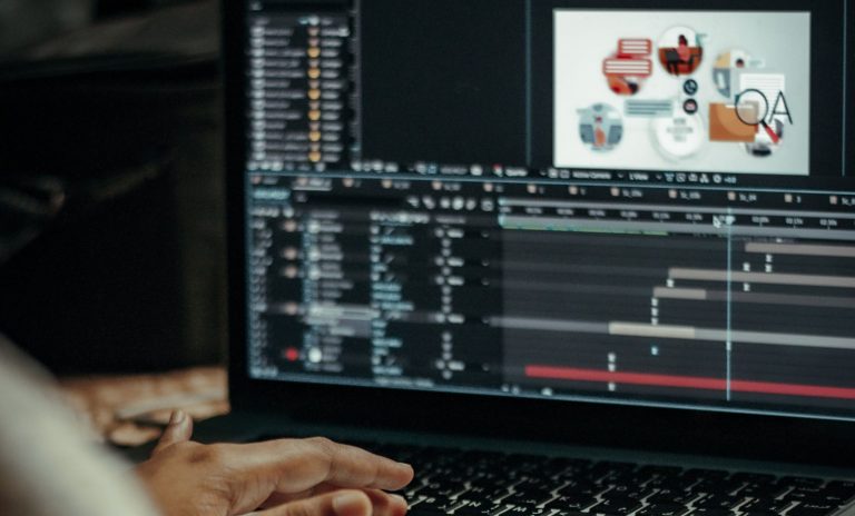 Person editing an animated video on a laptop