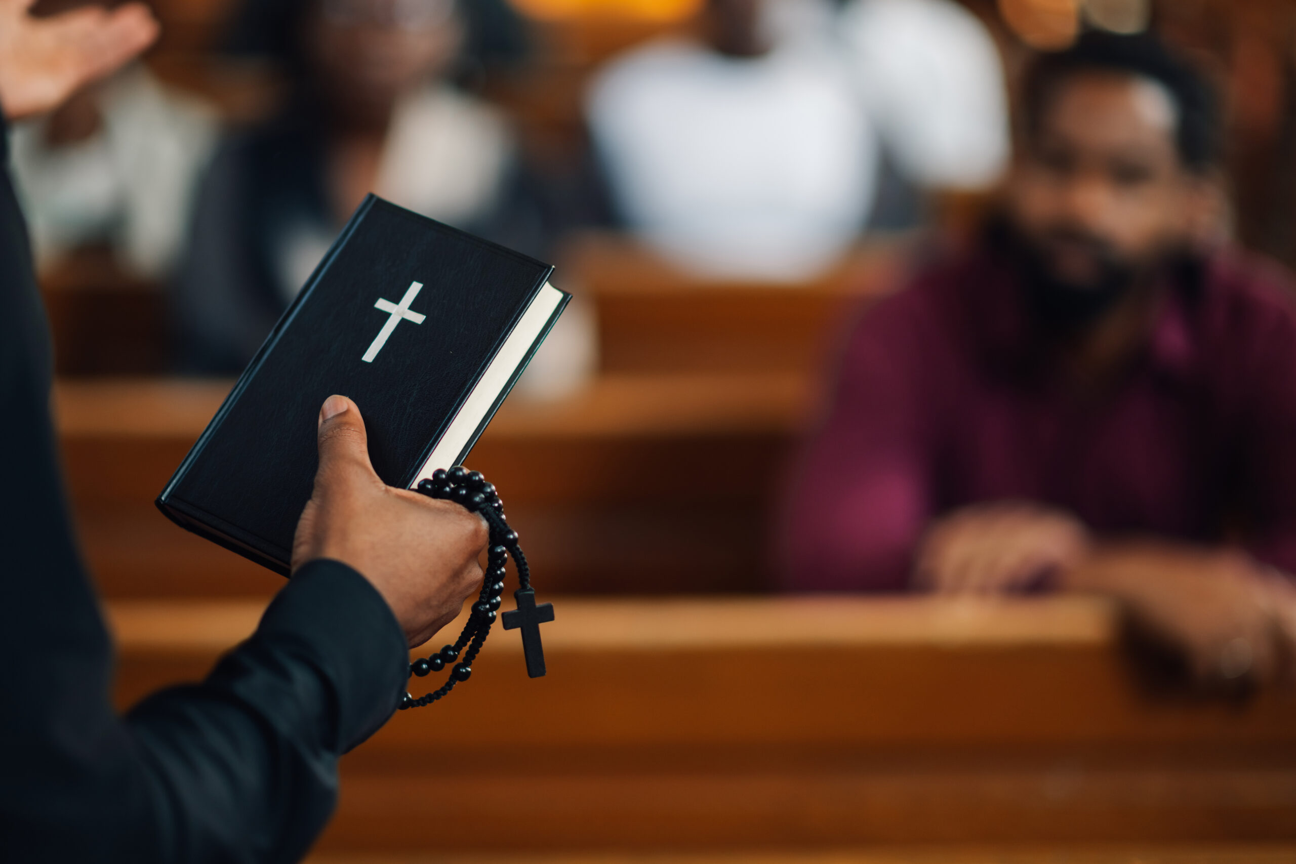 holding-bible-and-rosary-in-church-congregation-2026-01-09-07-19-13-utc